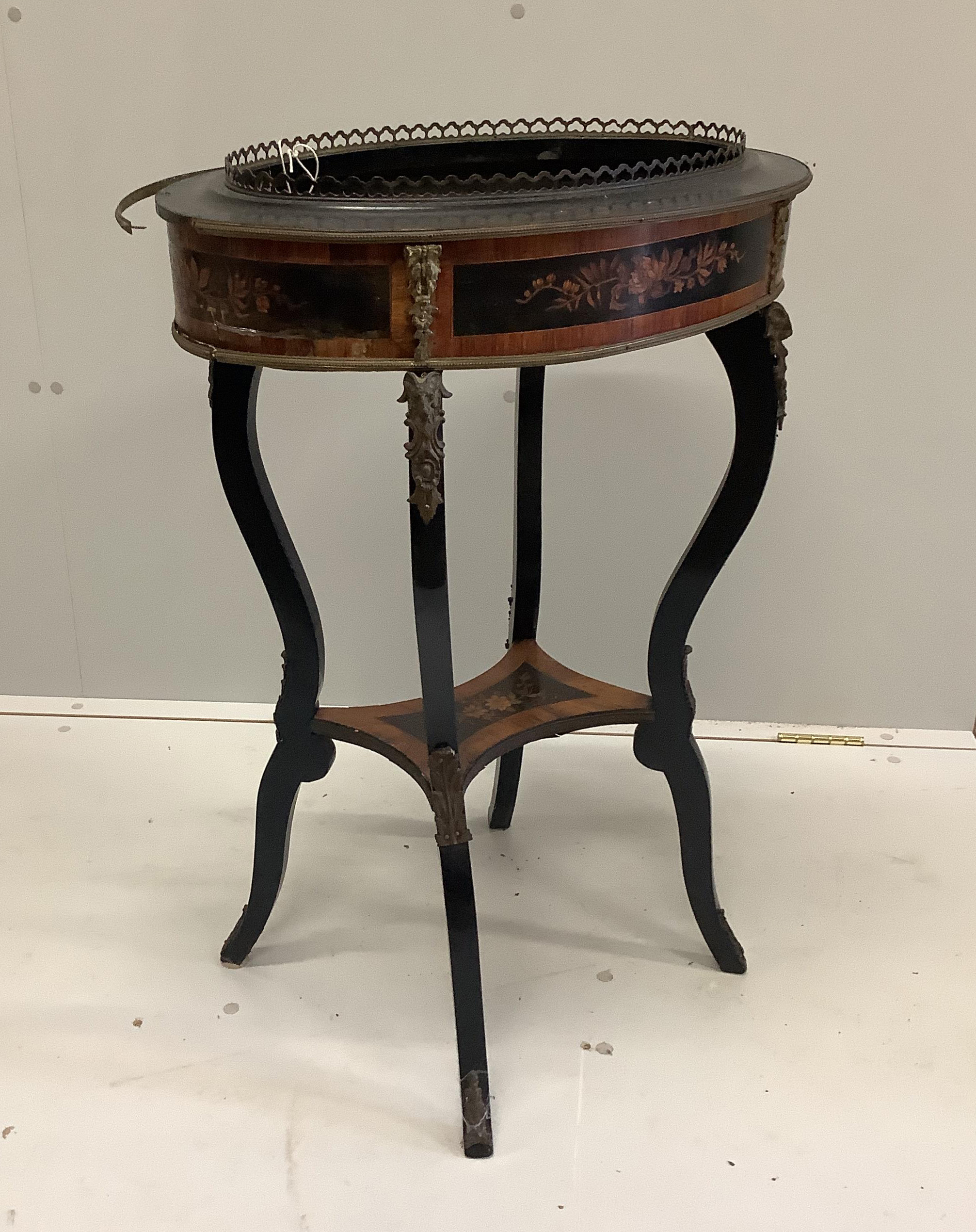 A late 19th century French marquetry inlaid ebonised and kingwood oval jardiniere table, width 56cm, depth 40cm, height 82cm